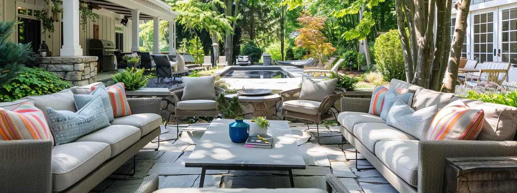 A shaded lounge area under a white pergola with hanging planters and a built-in grill, perfect for Easy Summer Decor Ideas for Your Outdoor Space