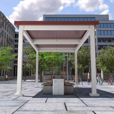 A white Structureworks Pavilion Trex Pergola with a red roof shades a round planter and bench setup in a city square
