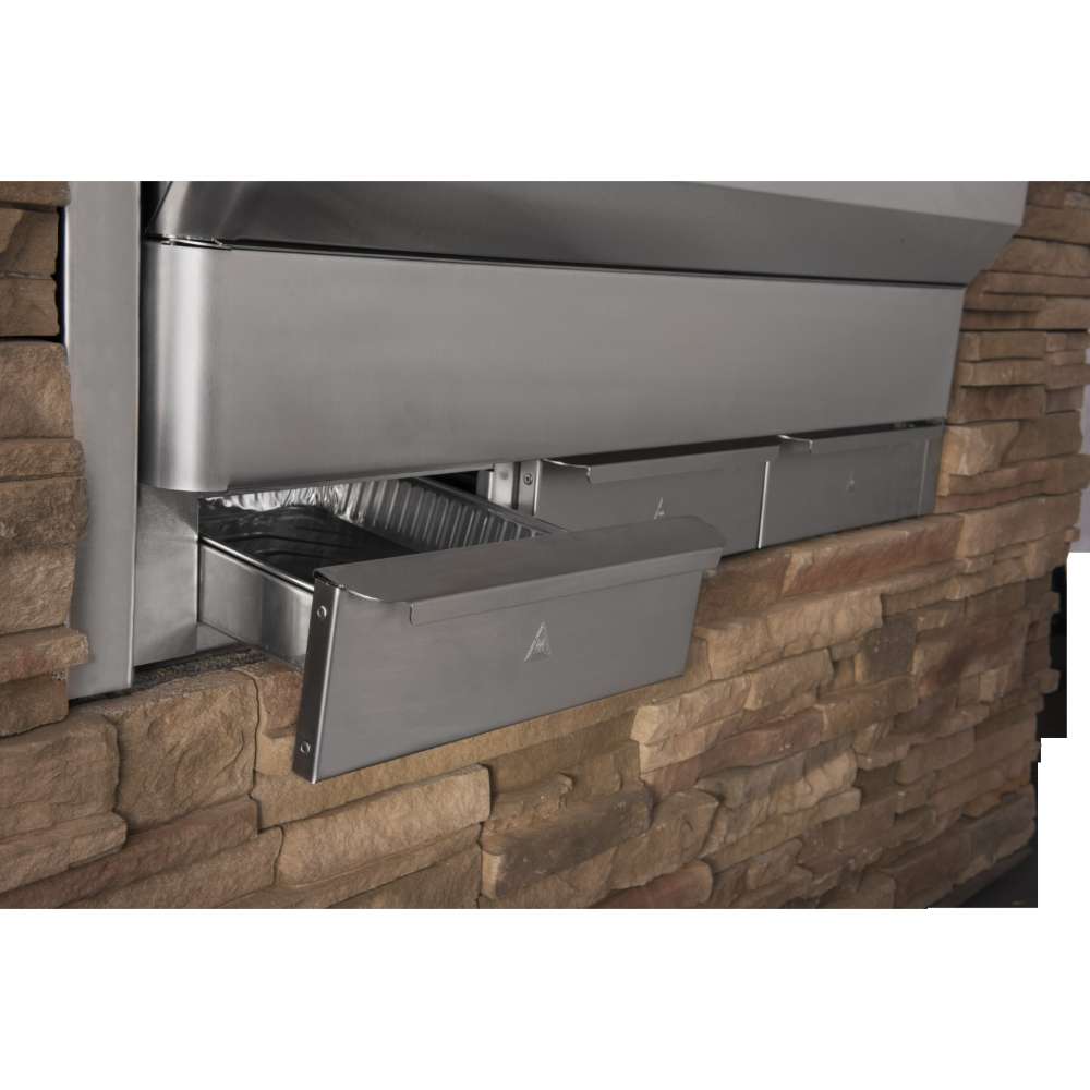 A built-in installation of the Memphis Grills Elite Cart ITC3 shows pull-out grease trays for easy cleaning