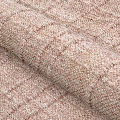 A close-up of the Couristan Ascot Indoor/Outdoor Rug - Windowpane/Rose shows its raised textured pattern with fine, dense yarns