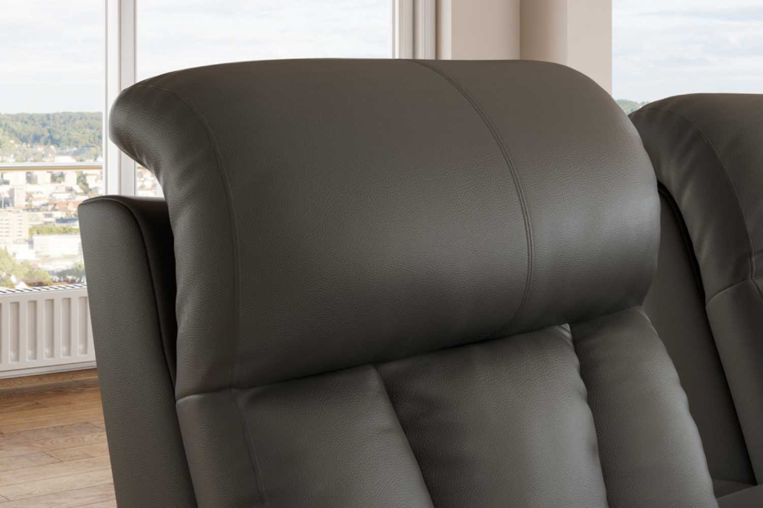A close-up of the Valencia Olivia Home Theater Seating's headrest, emphasizing its soft, padded leather finish and ergonomic support
