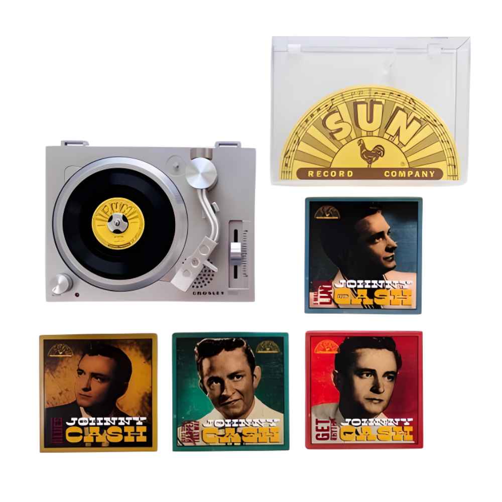 A flat lay of the Crosley RSD3 Player + Johnny Cash 3 Inch Vinyl - Set of 4 Records includes the turntable, the Sun Records case, and four vinyl records