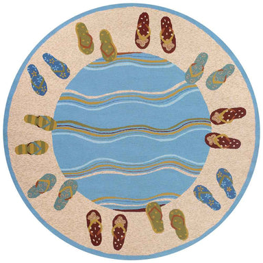 A round rug with a design of blue waves in the center and colorful flip-flops around the border is the 7'10 Round Couristan Covington Indoor/Outdoor Rug - Sandals/Sand-Multi