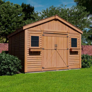 A side view of the Outdoor Living Today 12×16 Double Door Space Master Storage Shed highlights its deep structure and twin front windows, surrounded by greenery