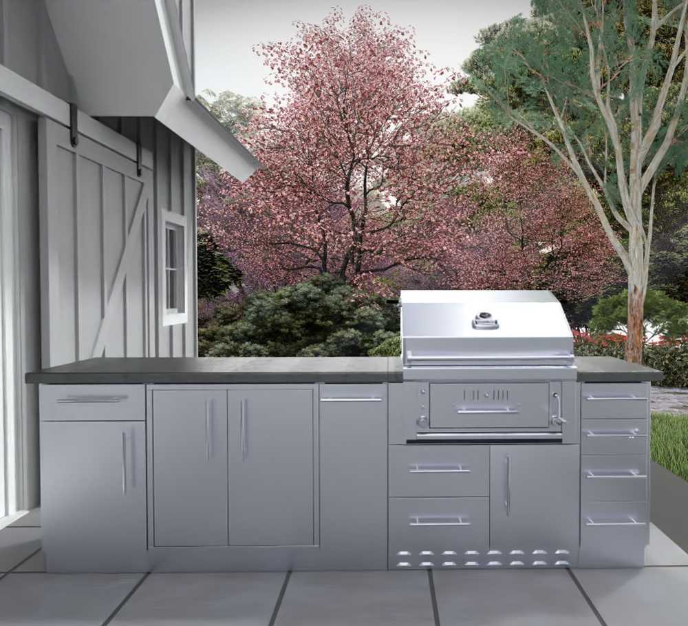 Sunstone Alamo 9ft Outdoor Hybrid Gas Charcoal Grill & Cabinet Island Package is placed beside a modern home exterior with tile flooring and blooming trees nearby