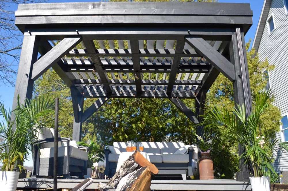 With its louvered roof partially opened, the Brookside Timber Frame Zion Resort Pergola allows natural light to filter through