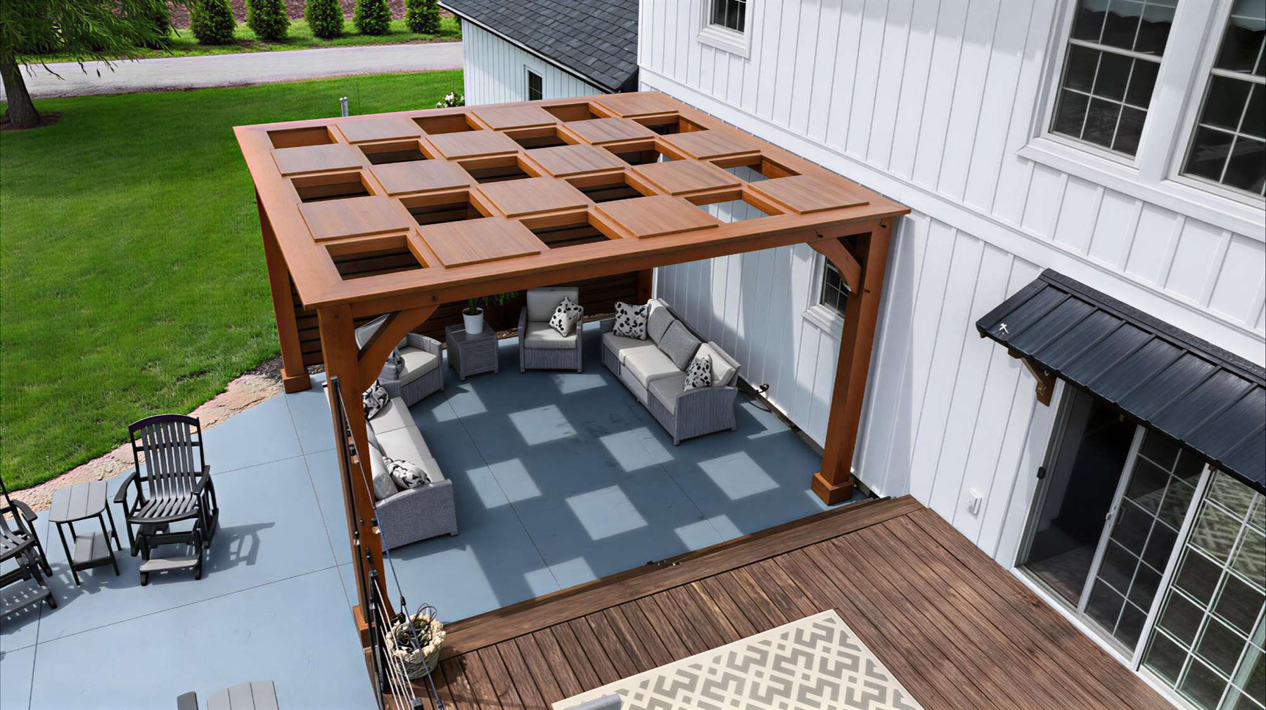 A backyard patio features a square wooden pergola with a patterned open roof casting shadows on the ground, demonstrating what is a pergola in a real home setting