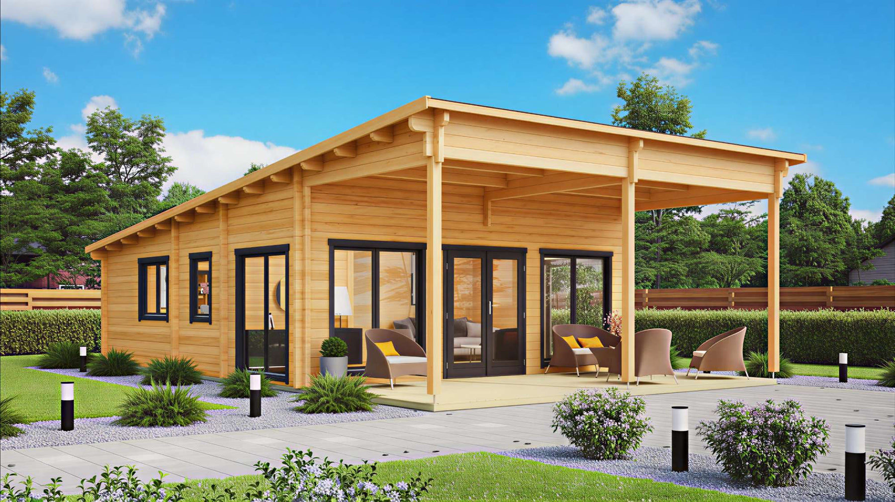 A modern wooden garden house for living with large glass doors sits in a sunny backyard surrounded by green shrubs and outdoor seating