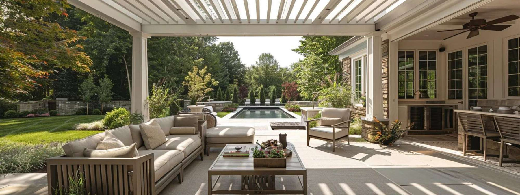 A shaded patio with modern aluminium pergola, plush seating, and ceiling fan shows how to Beat the Heat With Smart Outdoor Living Solutions in style
