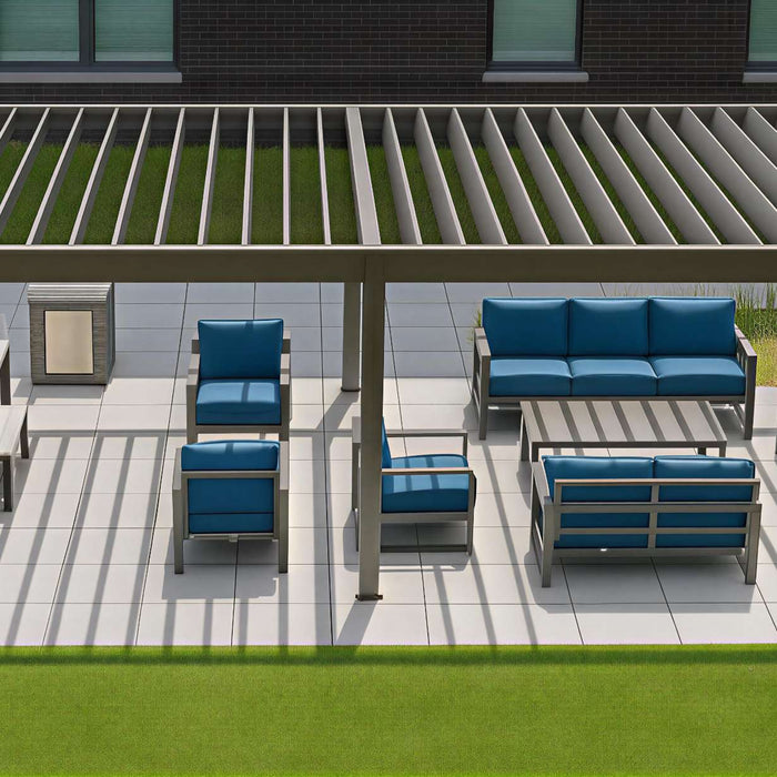 A structured pergola stands over coordinated lounge and dining furniture on a clean white patio, highlighting what is the purpose of a pergola in adding shade and definition