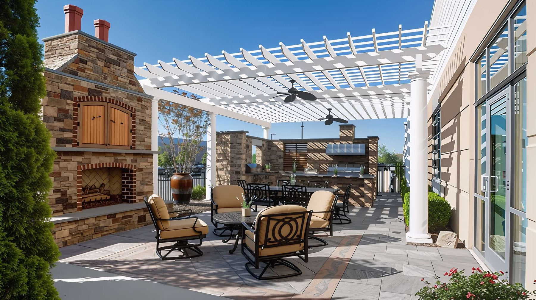 A stylish backyard with stone fireplace, ceiling fans, and cozy seating shows How to Furnish Under a Pergola for comfort, shade, and outdoor dining