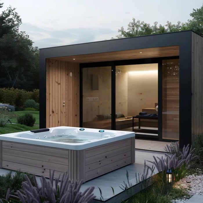 Backyard spa shed rental with a modern garden room, hot tub, landscaping, and soft outdoor lighting