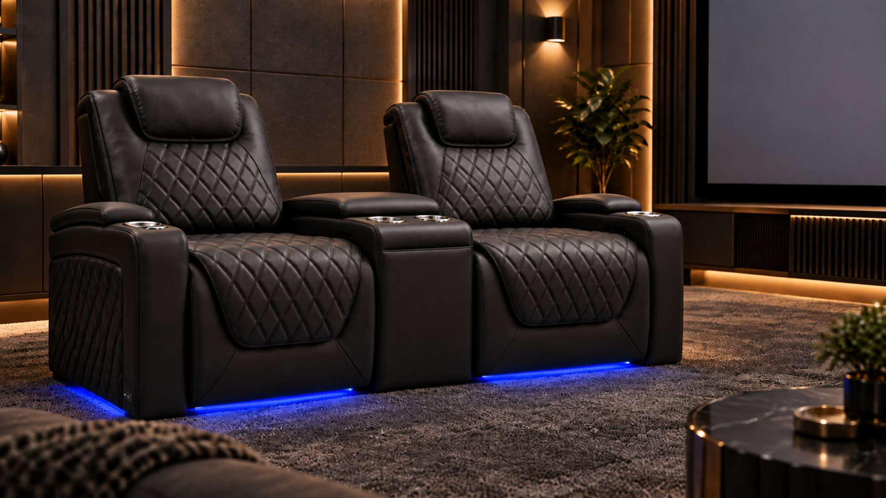Black leather home theater seating with console features quilted recliners, built-in cup holders, blue LED lighting, and a large cinema screen