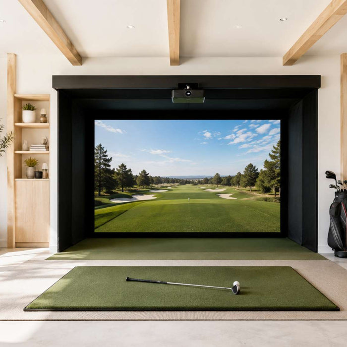 Bright home golf simulator room with a large golf course screen, green hitting mat, golf clubs, and light wood storage