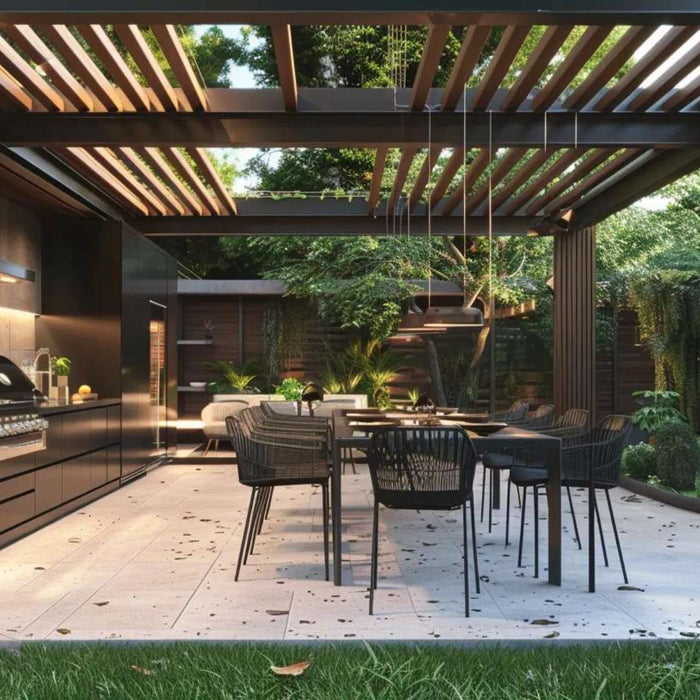 Modern covered patio showcasing outdoor kitchen uses with a built-in grill, dining area, and open pergola surrounded by greenery