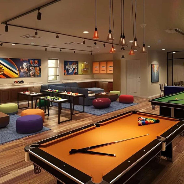 Modern multi purpose game room design with billiards tables, cozy sofas, gaming tables, and warm overhead lighting