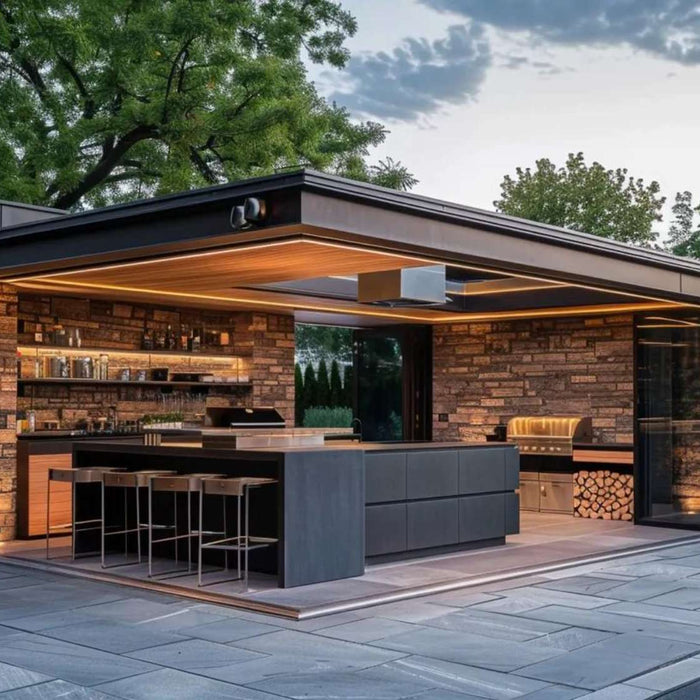 Modern outdoor kitchen with stone design, bar seating, and built-in grill for an outdoor cooking YouTube studio