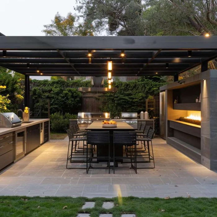 Modern pergola with an outdoor kitchen, long dining table, soft lighting, and built-in fireplace creates an elegant space ideal for hosting and generating farm to table dinner income