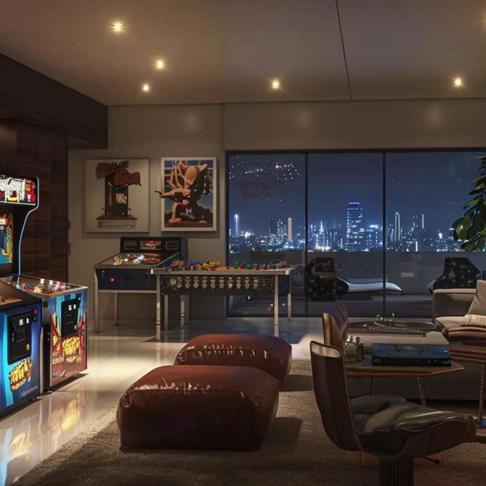 Modern game room with arcade cabinets, pinball machines, seating, and city views, showing what games to put in a game room for social and solo play