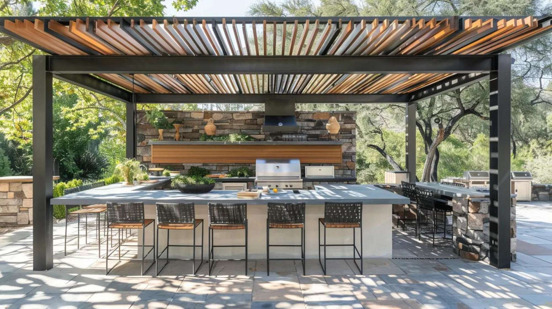 Outdoor kitchen photography of a modern pergola-covered kitchen with bar seating, stone accents, and natural light filtering through overhead slats