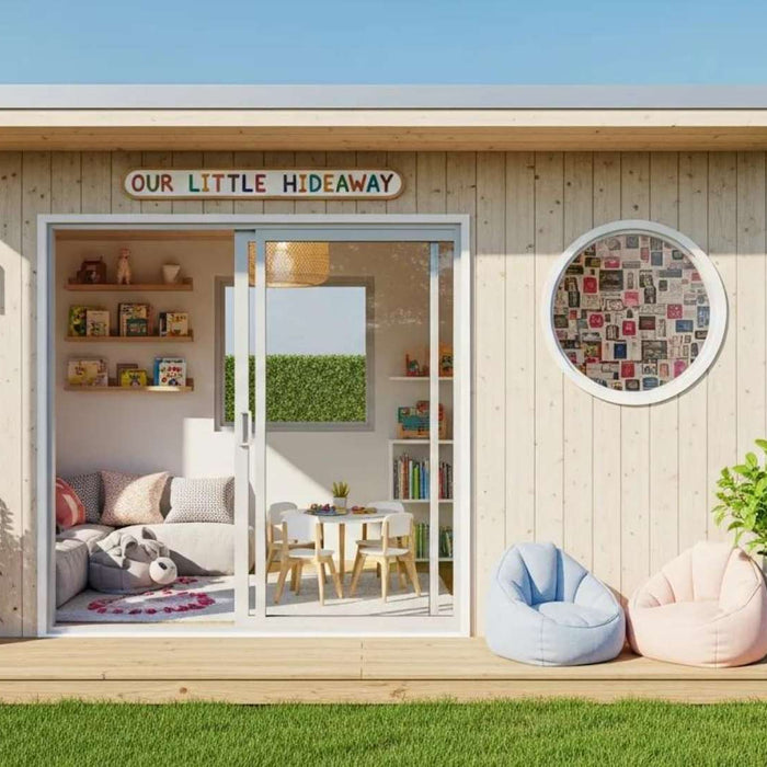 Small wooden she shed for kids with sliding glass doors, cozy seating inside, and soft chairs outside in a garden
