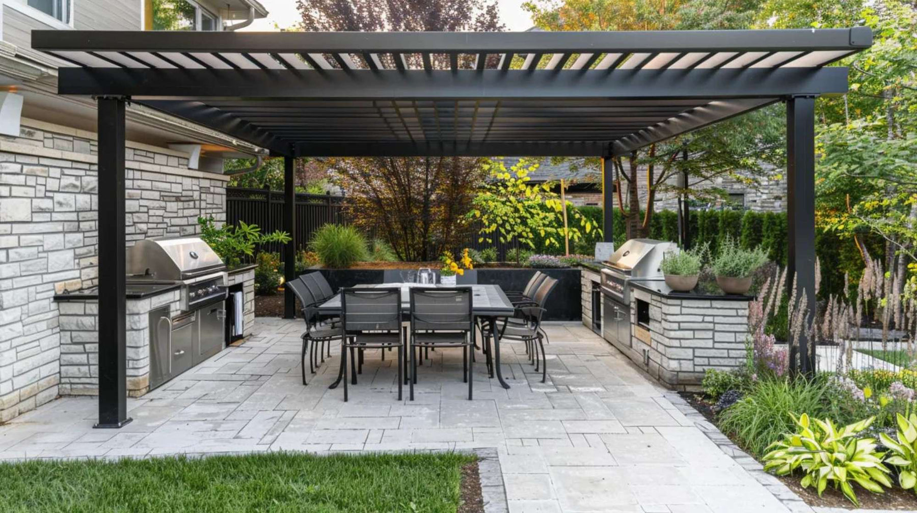 Spacious patio with built-in grills, shaded seating, and stone flooring creating a professional backyard BBQ business setup