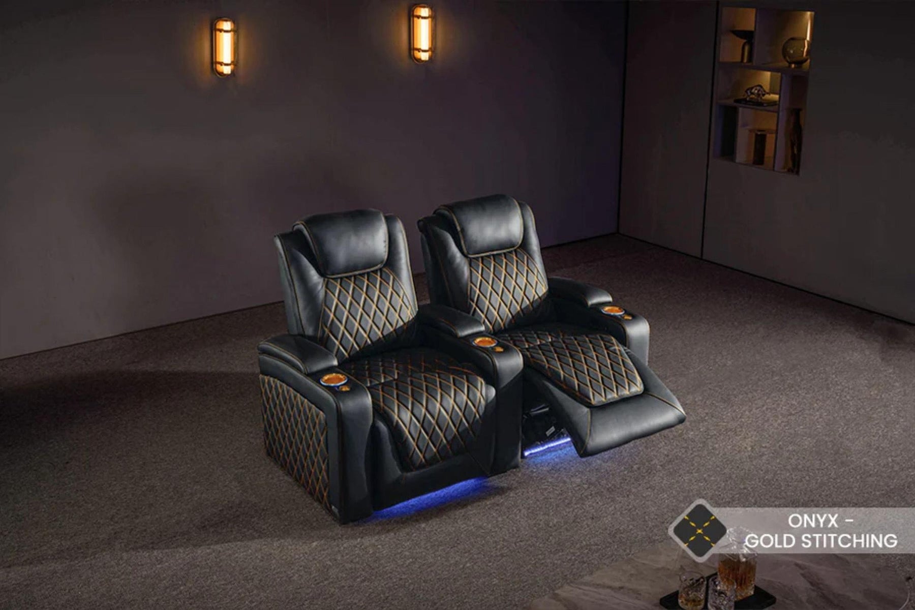 The image shows two luxurious black Valencia Oslo Home Theater Seating chairs with gold diamond stitching, LED lighting, and a reclining feature in a modern room