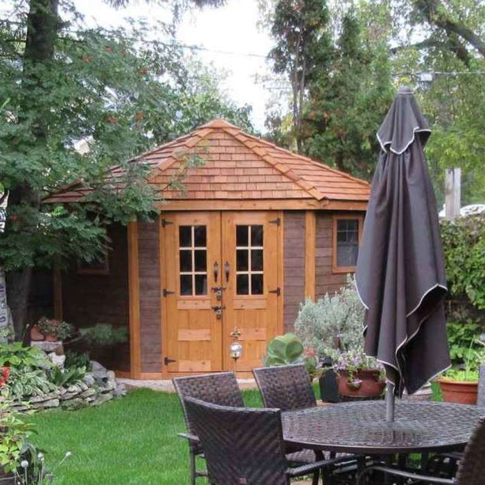 Wooden garden shed with double doors sits in a green backyard near patio furniture, a setup that often raises the question are sheds taxable