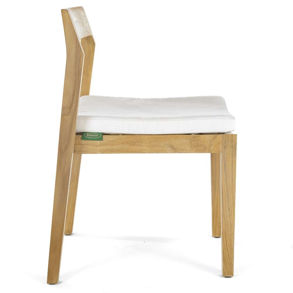Westminster Teak Horizon Teak Side Chair is shown from the side with a light cushion on the seat, emphasizing comfort along with its sleek wooden frame