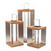 14 inch, 18 inch and 26 inch Crate & Barrel Blade Teak and Stainless Steel LED Solar Outdoor Lantern shown together in weathered teak and stainless steel