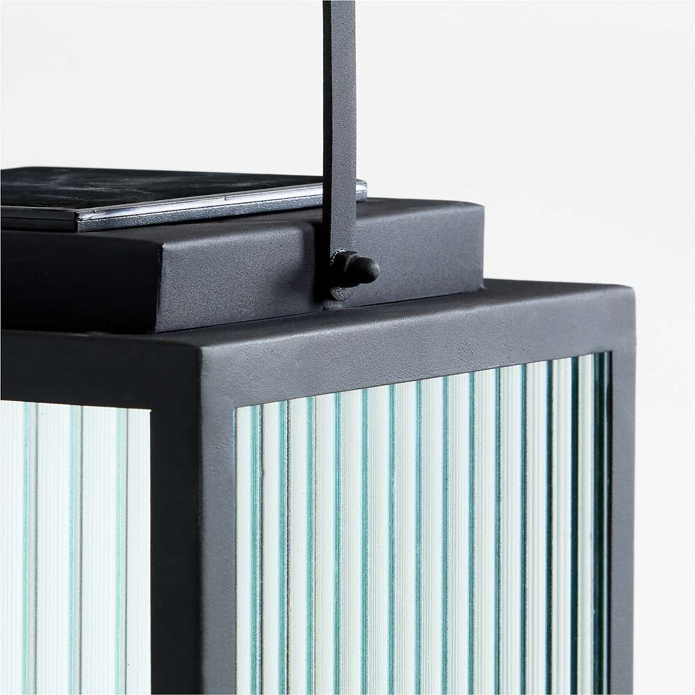 26.5 inch Crate & Barrel Alfresco Black Metal and Glass LED Solar Outdoor Lantern in an alternate view showing the removable solar panel on top