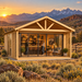 Front view of the ALU Concept Arosa 70C transformed into an upscale entertainment bar at golden hour amid sagebrush, rocky foothills, and distant Wyoming mountains.