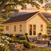 Farum 44 entertainment bar glowing at golden hour amid flowering dogwoods, vineyards, split-rail fencing, and rolling North Carolina Piedmont hills.
