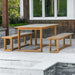 Westminster Teak Horizon Teak Dining Picnic Set on a patio near stone steps, planters, and house windows