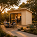 Rectangular light wood Starla 44A ALU studio with glass doors, featuring people sitting inside and outside at sunset.