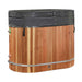 A black insulated cover with buckled straps closes the top of Golden Designs Dynamic Cold Therapy Oval Barrel Pacific Cedar Cold Plunge above its cedar sides