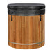 A black insulated cover with side latches sits on top of Golden Designs Dynamic Cold Therapy Barrel 304 Stainless Steel Cold Plunge and its cedar barrel sides