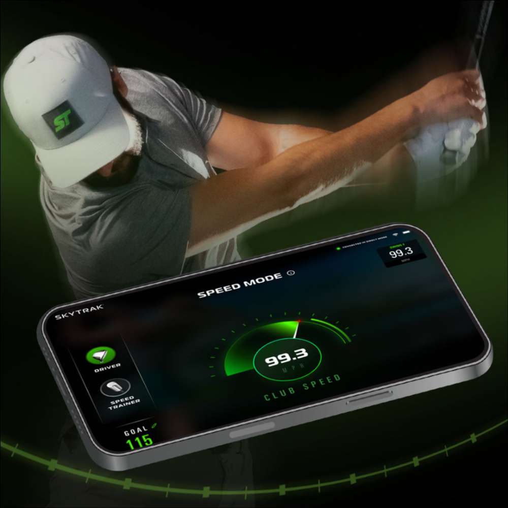 A golfer practicing their swing with a smartphone displaying club speed data from SKYTRAK ST MAX Launch Monitor