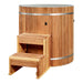 A two-step cedar staircase leads up to the rim of Golden Designs Dynamic Cold Therapy PVC Barrel Cold Plunge, a round barrel with vertical cedar staves