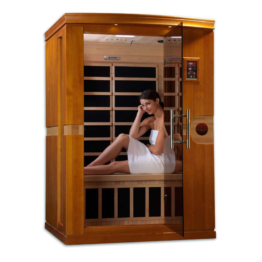 A woman in a white towel relaxes on the bench inside Golden Designs Dynamic Venice Elite 2 Person Ultra Low EMF Far Infrared Sauna