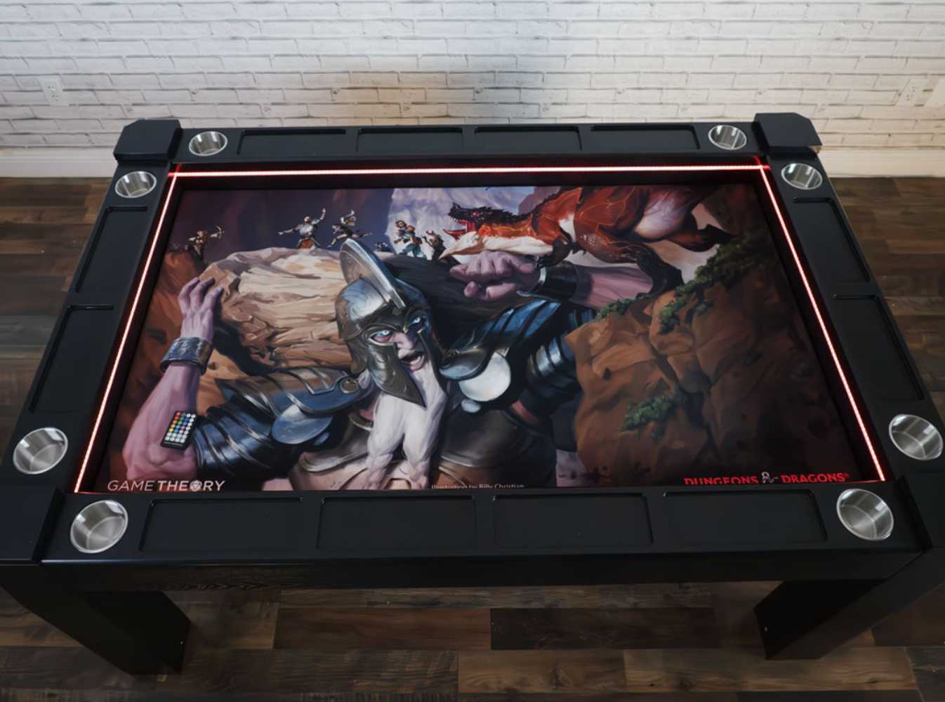 A Game Theory Tables Origins Lit table featuring an epic Dungeons & Dragons-themed illustration of a battle scene, surrounded by sleek cup holders and LED lighting