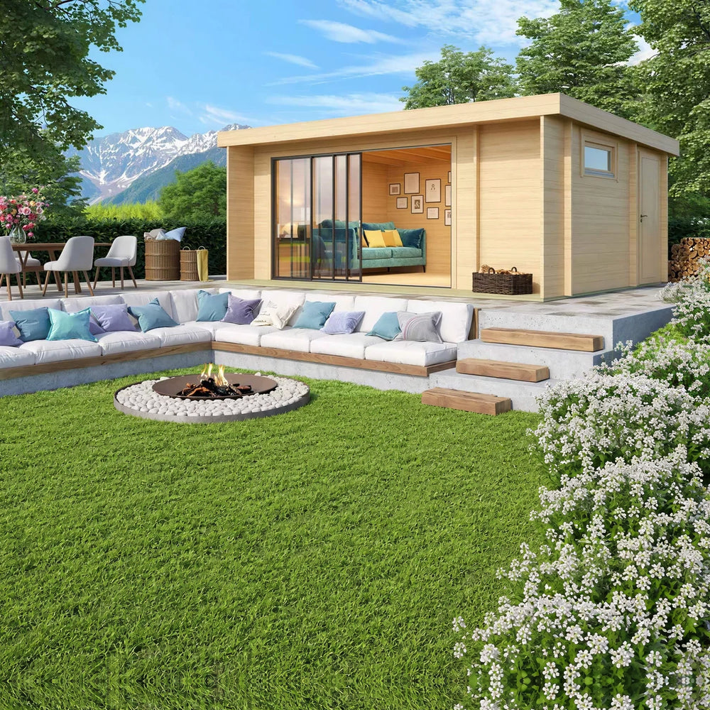 A cozy GardenHouse24 USA ALU Concept 70B Garden Room with large glass doors sits above a built-in firepit lounge and mountain views in the background