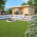 A cozy GardenHouse24 USA ALU Concept 70B Garden Room with large glass doors sits above a built-in firepit lounge and mountain views in the background
