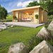 A modern wooden structure with full glass sliding doors and potted plants outside shows the cozy and stylish GardenHouse24 USA ALU Concept 70I Garden Room