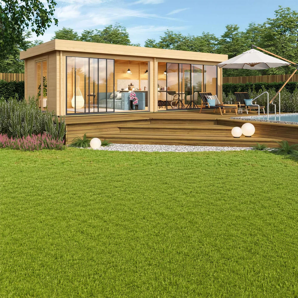 A cozy garden scene with patio, furniture, and greenery surrounds the sunlit GardenHouse24 USA ALU Concept Lounge 70B Garden Room