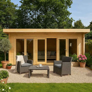A GardenHouse24 USA Taunus 70 Garden Room with large glass doors and a small gravel patio setup with outdoor chairs and plants