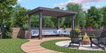 A Structureworks Solare Fiberglass Pergola shades a long cushioned bench near a fire pit, set in a landscaped backyard with curved pathways and trees