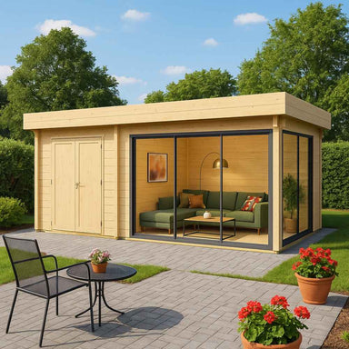 A bright, inviting garden room with floor-to-ceiling glass panels, a green sectional couch inside, and a neat garden patio—this is the GardenHouse24 USA ALU Concept 70J Garden Room