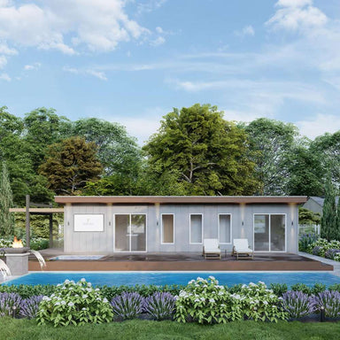 A centered front view of Sawmill Structures The Jasper Garden Suites highlights the clean lines of the suite, twin lounge chairs, a beautiful pool, and lush landscaping