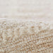A close-up of Momeni Archer Indoor Rug - ARC-3 Beige highlights its looped texture and plush wool blend